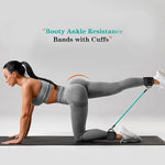 Person exercising with booty ankle resistance bands with cuffs on a gray background