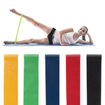 Woman using a resistance band for a glute and lower body workout